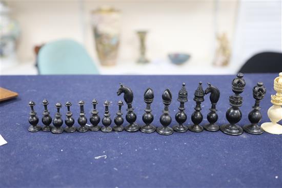 A mid 19th century Anglo Indian turned black stained and natural ivory chess set, kings 3.5in.